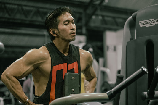 Man takes a breather after working out at the gym.