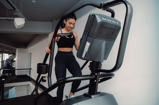 A woman on a treadmill in a gym